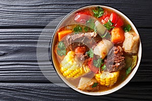 SancochoÃÂ is a meats and vegetables stew, enjoyed in Latin America and the Spanish Caribbean islands close-up on a bowl. photo